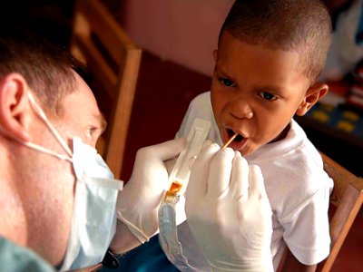 US Navy 090526-F-1333S-023 A service member embarked aboard the Military Sealift Command hospital ship USNS Comfort (T-AH 20) gives a Fluoride treatment to a patient during a Continuing Promise 2009 medical civil service projec