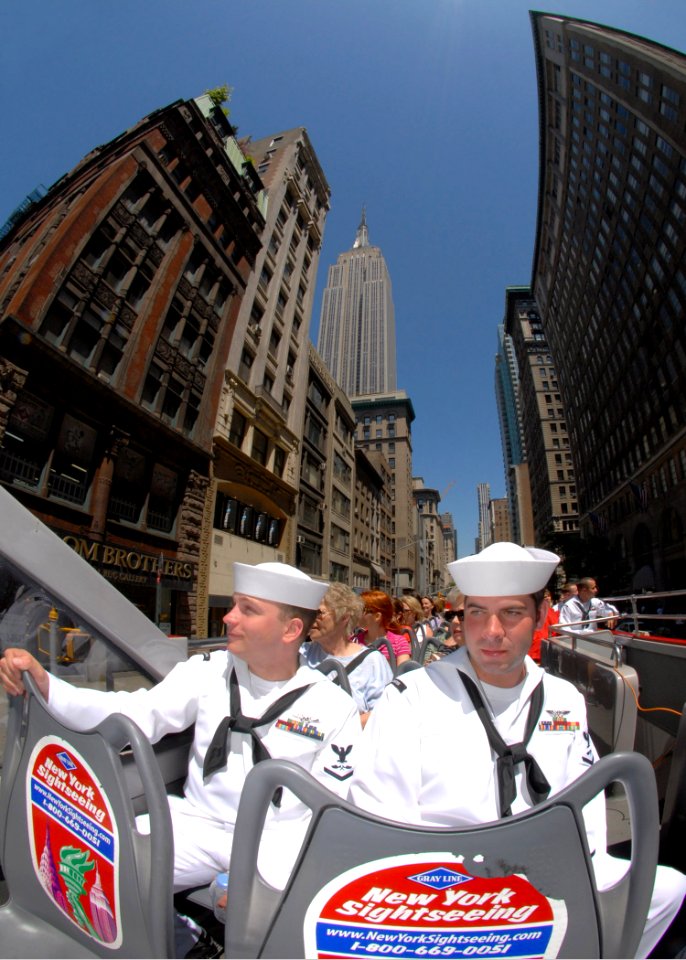 US Navy 090521-N-4856C-240 Aviation Structural Mechanic 3rd Class Michael Spiegler and Aviation Structural Mechanic 3rd Class Dustin Davis ride a double-decker tour bus in Manhattan during Fleet Week New York City 2009