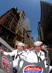 US Navy 090521-N-4856C-240 Aviation Structural Mechanic 3rd Class Michael Spiegler and Aviation Structural Mechanic 3rd Class Dustin Davis ride a double-decker tour bus in Manhattan during Fleet Week New York City 2009