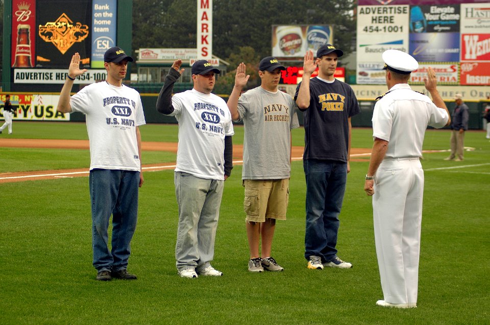 US Navy 090526-N-7975R-011 Cmdr. Curt Jones, commanding officer of Pre-Commissioning Unit (PCU) New York (LPD-21), presides over a swearing-in ceremony at Frontier Field