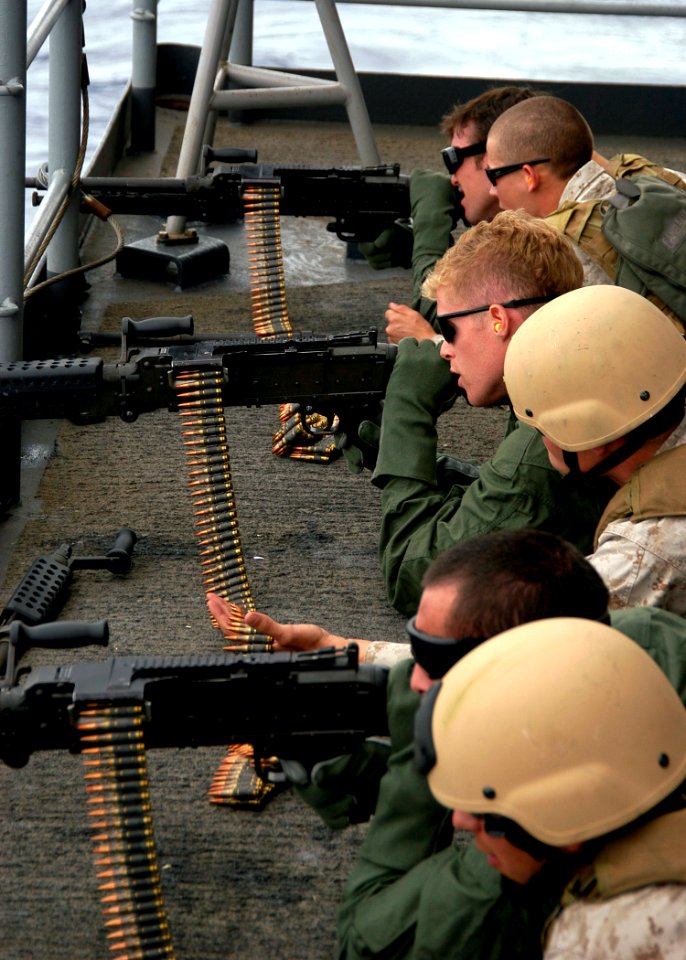 US Navy 090522-N-6720T-049 Marines assigned to Fleet Anti-Terrorism Security Team Pacific (FASTPAC) instruct sailors during an M-240B machine gun live-fire exercise aboard the aircraft carrier USS George Washington (CVN-73)