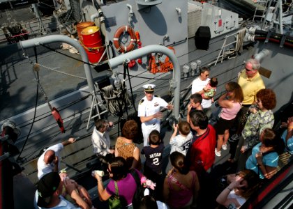 US Navy 090524-N-4936C-118 Lt. Cmdr. McCormack Harkin, commanding officer of the Cyclone-class coastal patrol ship USS Tempest (PC 2), explains the elements of his ship to civilians during a ship's tour on Staten Island
