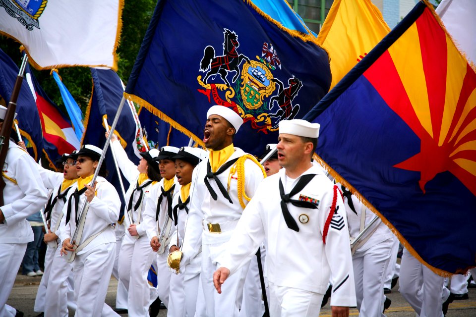 US Navy 090525-N-3271W-030 Sailors assigned to Navy Recruiting Command Great Lakes, Division 929, march as the 50-Sate Flag Team during the Janesville Memorial Day Parade