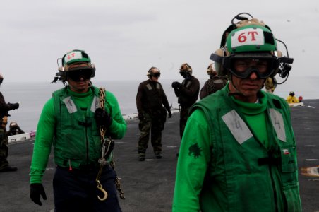US Navy 090528-N-3610L-444 Aviation Electronics Technician 1st Class Michael Davis returns to his position aboard the aircraft carrier USS Ronald Reagan (CVN 76) after a foreign object debris (FOD) walk down on the ship's fligh