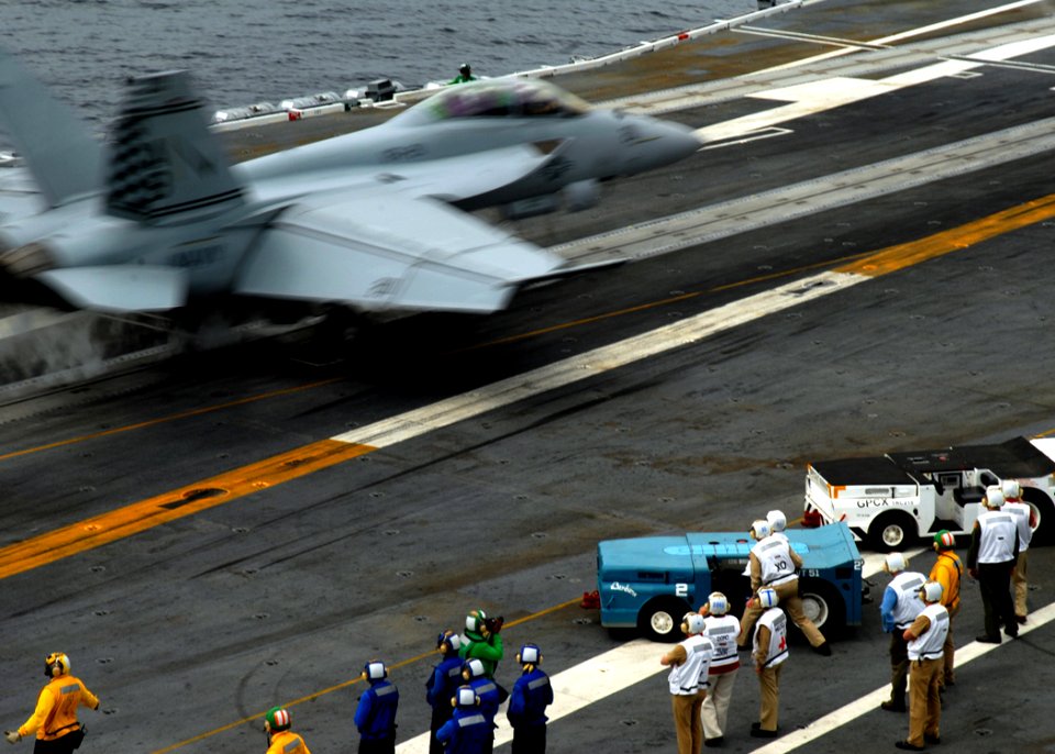 US Navy 090526-N-6125G-111 Former U.S. President George H.W. Bush and Capt. Bob Roth, executive officer of the aircraft carrier USS George H.W. Bush (CVN 77) watch as an F-A-18F Super Hornet from Fighter Attack Squadron (VFA) 2