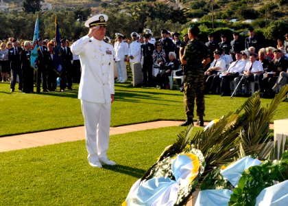US Navy 090524-N-0780F-001 Capt. Thomas J. McDonough, commanding officer, Naval Support Activity Souda Bay renders a salute after laying a wreath at the Allied War Cemetery at Souda Bay photo