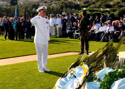 US Navy 090524-N-0780F-001 Capt. Thomas J. McDonough, commanding officer, Naval Support Activity Souda Bay renders a salute after laying a wreath at the Allied War Cemetery at Souda Bay