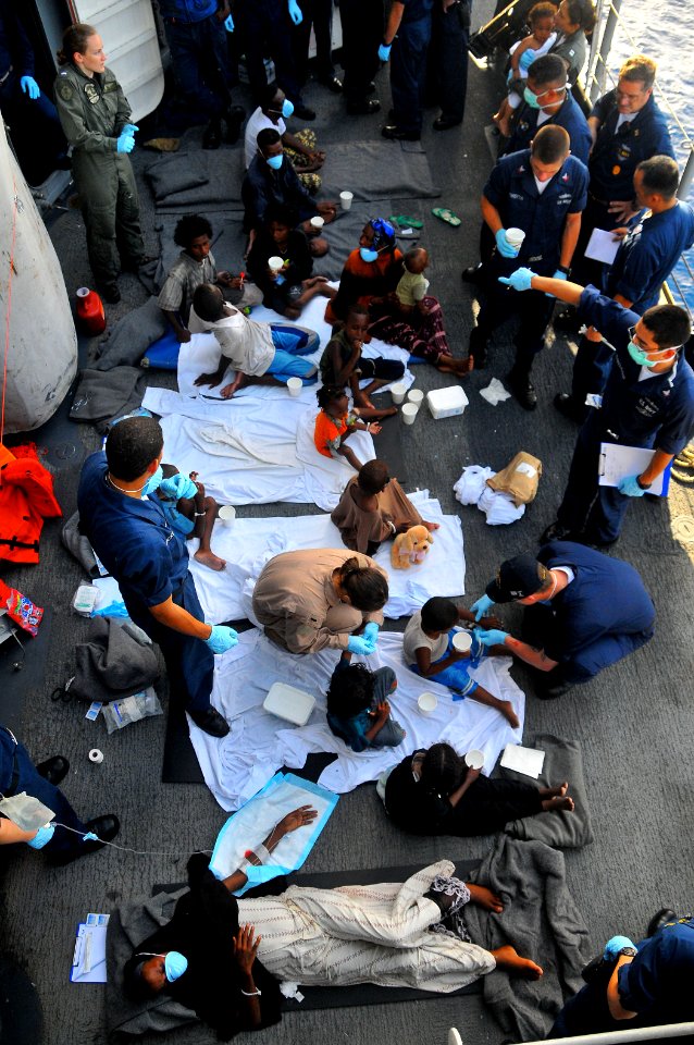 US Navy 090524-N-4774B-220 Somali migrants, including a nine-month pregnant female, are treated aboard the guided-missile cruiser USS Lake Champlain (CG 57), after being rescued from a disabled skiff