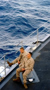 US Navy 090523-N-5345W-348 Marines from the 22nd Marine Expeditionary Unit (22 MEU) watch from the foc'sle as the amphibious dock landing ship USS Fort McHenry (LSD 43) conducts an underway replenishment