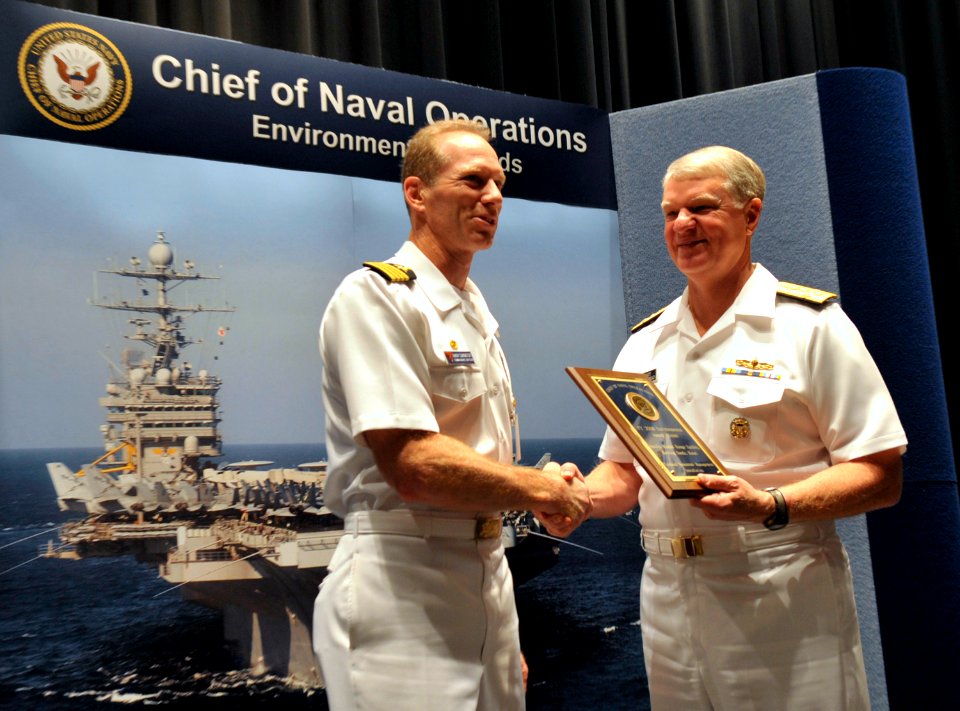 US Navy 090528-N-8273J-045 Chief of Naval Operations (CNO) Adm. Gary Roughead congratulates Capt. Aaron Cudnohafsky, commanding officer of the Pacific Missile Range Facility (PMRF), Kauai, Hawaii