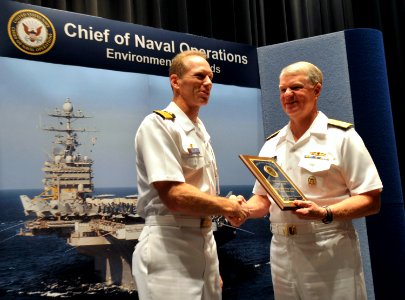 US Navy 090528-N-8273J-045 Chief of Naval Operations (CNO) Adm. Gary Roughead congratulates Capt. Aaron Cudnohafsky, commanding officer of the Pacific Missile Range Facility (PMRF), Kauai, Hawaii