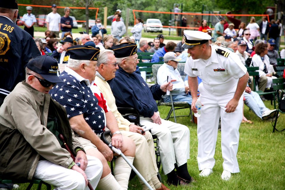 US Navy 090525-N-3271W-126 Lt. Ron Flesvig speaks with veterans before the Janesville Memorial Day Celebration, an event that coincides with Rock County Navy Week, one of 21 Navy Weeks planned across America in 2009