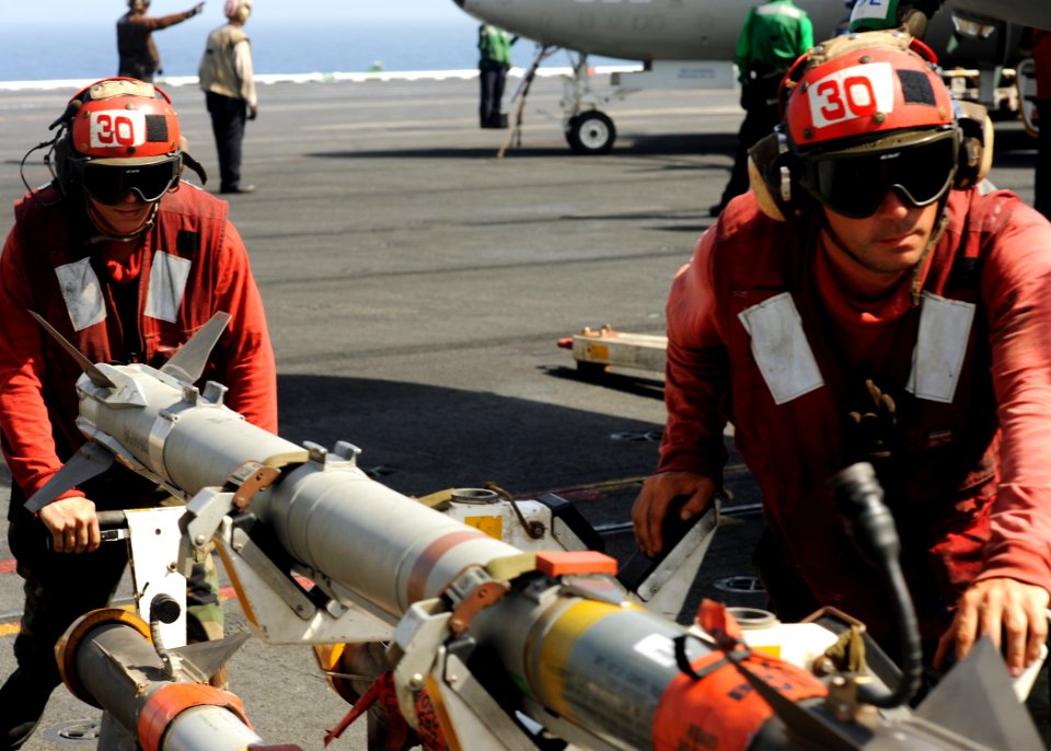 US Navy 090526-N-9988F-055 viation Ordnancemen move a GBU-12 aboard the aircraft carrier USS Dwight D. Eisenhower (CVN 69)