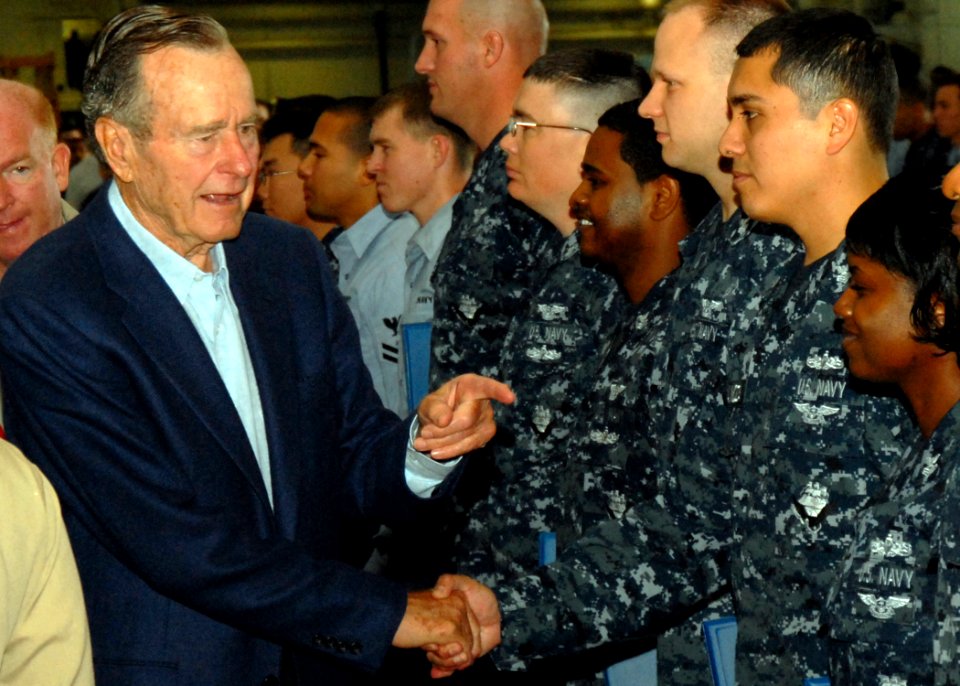 US Navy 090527-N-6125G-033 Former U.S. President George H.W. Bush meets with Sailors aboard the aircraft carrier USS George H.W. Bush (CVN 77) during a mass reenlistment and frocking ceremony