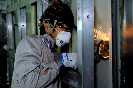 US Navy 090528-N-3830J-028 A member of the local ship repair facility team begins a refurbishing project in the 7th Fleet staff berthing aboard the amphibious command ship USS Blue Ridge (LCC 19)