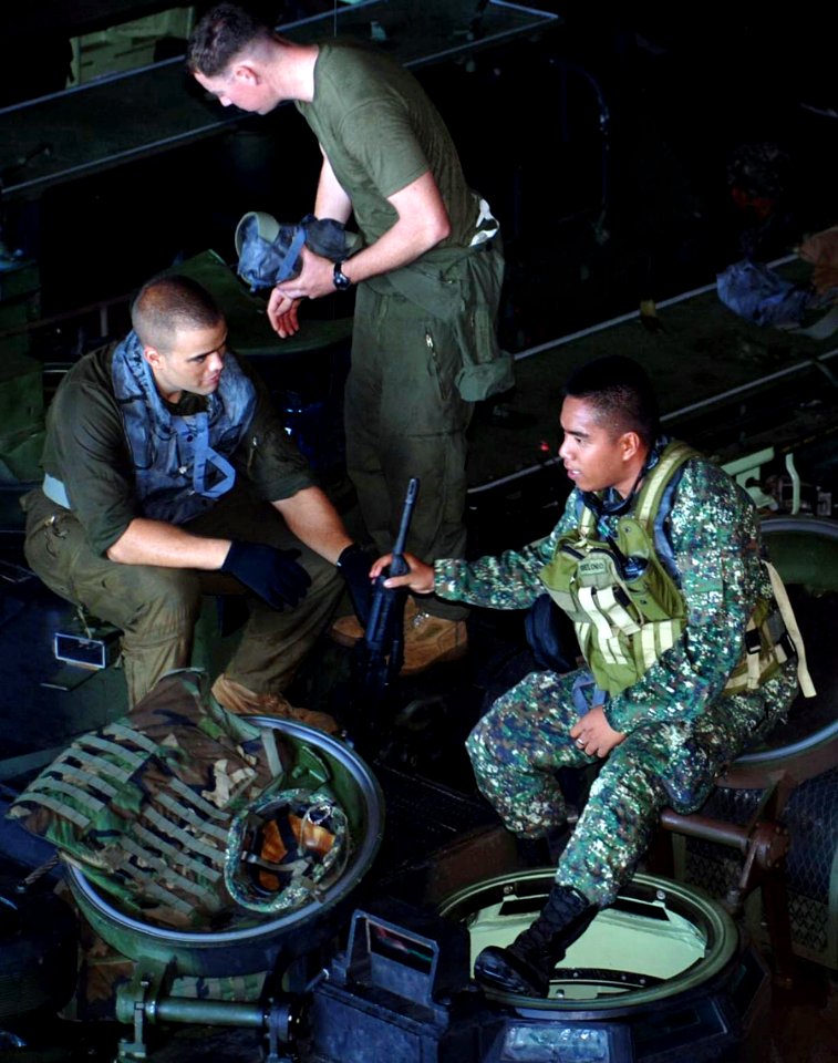 US Navy 090526-N-5207L-086 Philippine and U.S. Marines prepare in the well deck of the dock landing ship USS Harpers Ferry (LSD 49) for a combined amphibious landing exercise