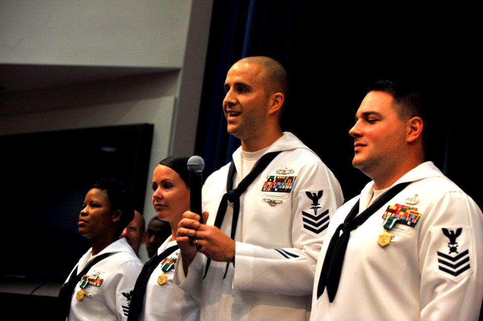 US Navy 090529-N-8273J-119 Hospital Corpsman 1st Class James Nicholson, middle, thanks his family and shipmates after being awarded Chief of Naval Operations Shore Activities Sailor of the Year