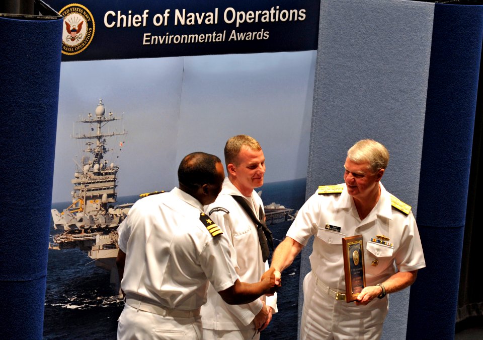 US Navy 090528-N-8273J-062 Chief of Naval Operations (CNO) Adm. Gary Roughead congratulates crew members of the guided-millile frigate USS Underwood (FFG 36)