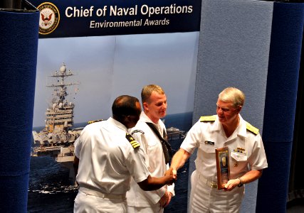 US Navy 090528-N-8273J-062 Chief of Naval Operations (CNO) Adm. Gary Roughead congratulates crew members of the guided-millile frigate USS Underwood (FFG 36)