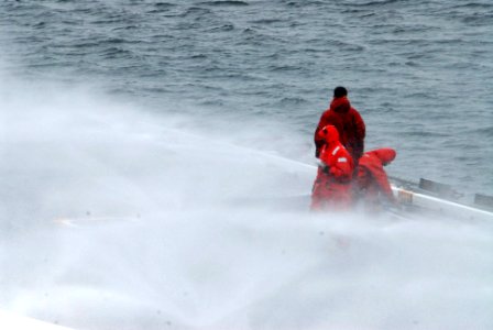 US Navy 090528-N-2344B-250 Sailors conduct a countermeasure wash down on the flight deck of the aircraft carrier USS Ronald Reagan (CVN 76)