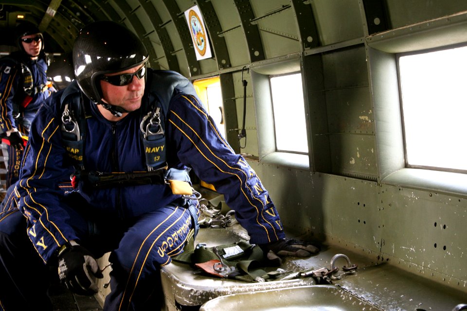 US Navy 090529-N-3271W-089 Members of the U.S. Navy demonstration parachute team, the Leap Frogs, prepare to jump from a 1942 commemorative Air Force C-47