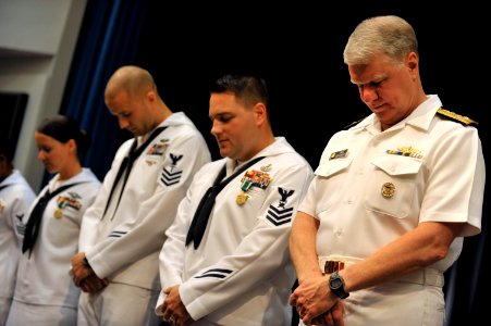 US Navy 090529-N-8273J-154 Chief of Naval Operations (CNO) Adm. Gary Roughead, and the finalists of the CNO Shore Activities Sailor of the Year, bow their heads during the benediction of the SOY announcement ceremony at the Pen