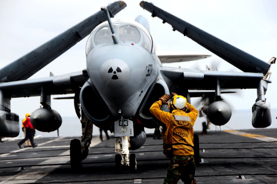 US Navy 090530-N-3946H-086 A plane director guides an EA-6B Prowler assigned to the