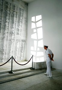 US Navy 090530-N-6538W-073 Capt. Joseph W. Kuzmick, commanding officer of the aircraft carrier USS John C. Stennis (CVN 74), reads names of fallen Sailors and Marines at the USS Arizona Memorial