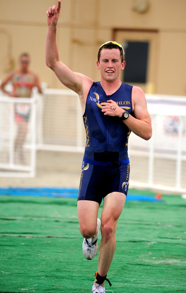 US Navy 090530-N-1722M-675 Ensign Derek Oskutis wins the Armed Forces Triathlon at Naval Base Ventura County
