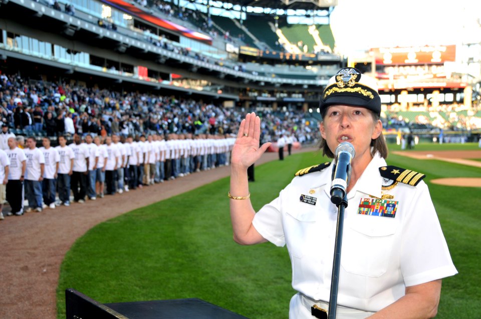 US Navy 090603-N-8848T-021 Cmdr. Rhonda K. Harders, commanding officer of Naval Recruiting District Chicago, enlists 86 new Navy recruits at U.S. Cellular Field