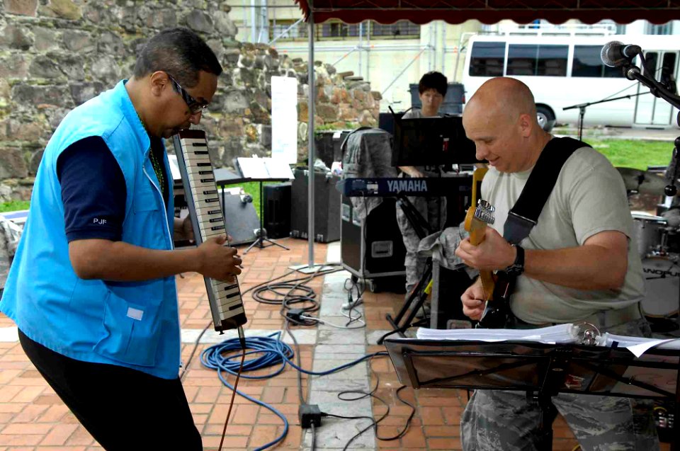 US Navy 090602-F-7923S-081 Danilo Perez, president of the Danilo Perez Foundation, plays jazz with Master Sgt. Terry Cottrell, a guitarist with the Air Force South Band, during a Continuing Promise 2009 special concert