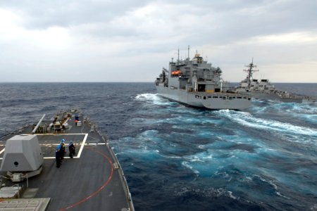 US Navy 090529-N-9123L-113 Sailors aboard the guided-missile destroyer USS McCampbell (DDG 85) stand by as the ship comes alongside the Military Sealift Command fleet replenishment oiler USNS Richard E. Byrd (T-AKE 4)
