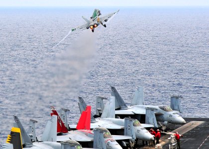 US Navy 090604-N-6233C-011 An F-A-18C Hornet from the Dambusters of Strike Fighter Squadron (VFA) 195, launches from the aircraft carrier USS George Washington (CVN 73)