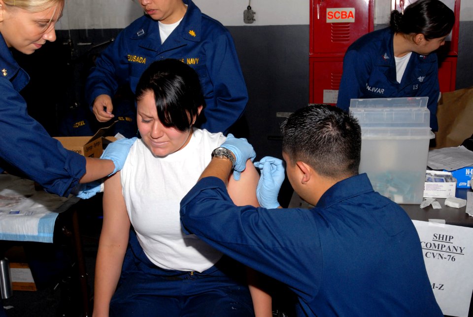 US Navy 090531-N-5586R-029 Boatswain's Mate Seaman Maria Orcillo receives both the anthrax and smallpox vaccines simultaneously aboard the aircraft carrier USS Ronald Reagan (CVN 76)