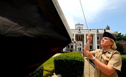 US Navy 090604-N-5328N-086 Cryptologic Technician (Interpretive) Seaman Shannon Parmley, a student at the Center for Information Dominance Corry Station, raises the black flag for the first time in 2009