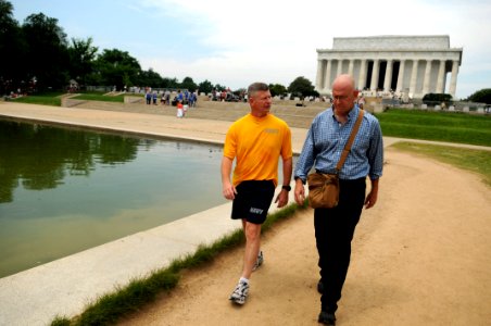 US Navy 090602-N-9818V-192 Master Chief Petty Officer of the Navy (MCPON) Rick West speaks with Navy Times reporter Mark Faram during a walking meeting along the National Mall