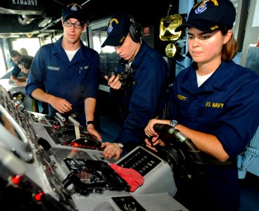 US Navy 090603-N-1831S-005 Midshipmen 2nd Class Sarah Van Cott, from the University of Michigan, and Ryan Frebowitz, from The Citadel, both enrolled in their school ROTC program, learn about shipboard navigation