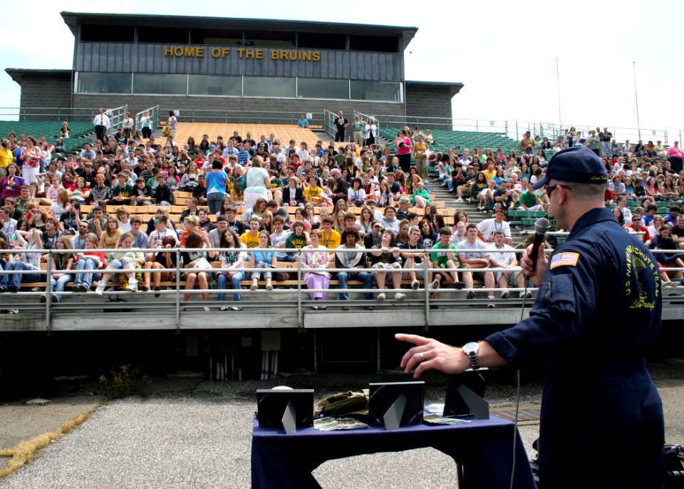 US Navy 090602-N-5366K-002 Lt. Cmdr. Robert Kaminski (SEAL), assigned to the U.S. Navy Parachute Team, the Leap Frogs, speaks to students about Naval Special Warfare before a parachute demonstration by the Leap Frogs at Brooke