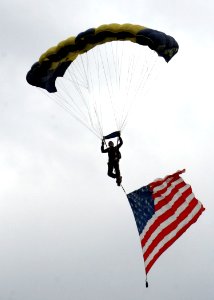 US Navy 090530-N-5366K-036 Chief Special Warfare Operator (SEAL) William Davis, assigned to the U.S. Navy Parachute Team, the Leap Frogs, makes his final approach to land at Southern Wisconsin AirFest 2009 photo