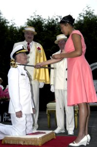 US Navy 090605-N-7783B-042 Rear Adm. James D. Kelly, deputy commander, Navy Region Northwest, kneels to be knighted