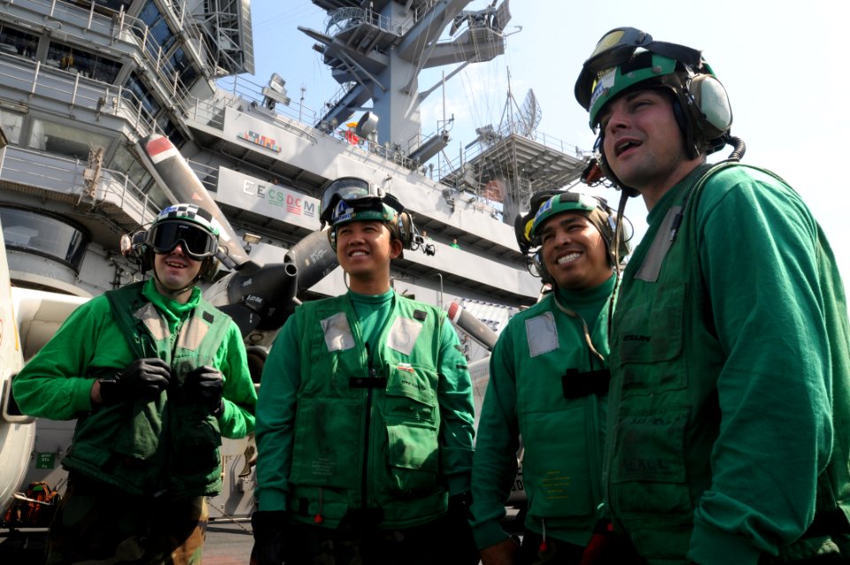 US Navy 090601-N-2344B-004 Sailors assigned to the Fighting Redcocks of Strike Fighter Squadron (VFA) 22 stand by for further instructions before an emergency drill
