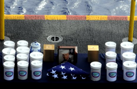US Navy 090609-N-3610L-073 The ashes of service members and their spouses are arranged on a table during a burial at sea ceremony aboard the aircraft carrier USS Ronald Reagan (CVN 76)