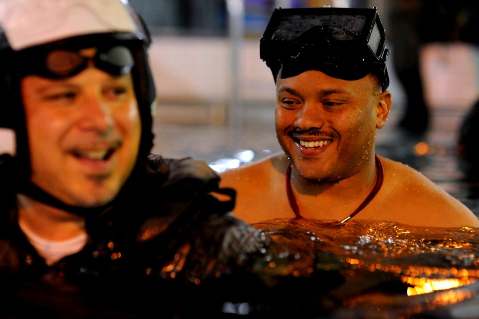 US Navy 090604-N-0413R-026 Chief Hospital Corpsman Todd Mays supervises a student during the Shallow Water Initial Motor Memory Egress Release (SWIMMER) training exercise at the Aviation Survival Training Center in Jacksonville