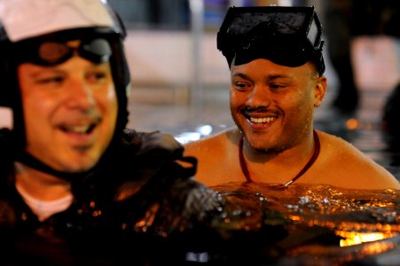 US Navy 090604-N-0413R-026 Chief Hospital Corpsman Todd Mays supervises a student during the Shallow Water Initial Motor Memory Egress Release (SWIMMER) training exercise at the Aviation Survival Training Center in Jacksonville