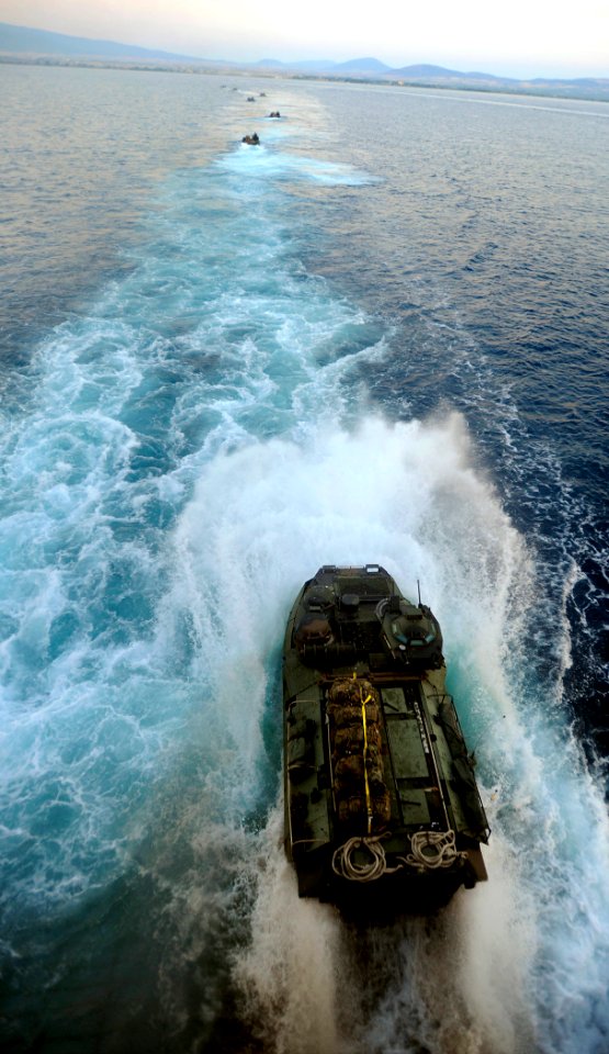 US Navy 090605-N-5345W-035 Amphibious assault vehicles from the 22nd Marine Expeditionary Unit (22 MEU) splash into the Aegean Sea from the well deck of the amphibious dock landing ship USS Fort McHenry (LSD 43)