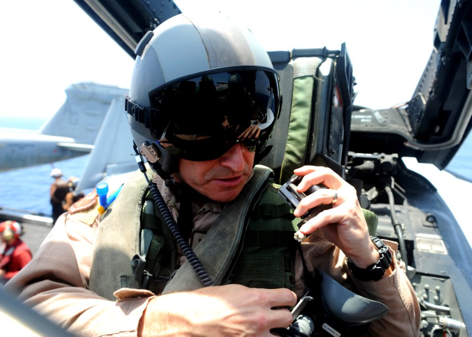 US Navy 090606-N-9988F-814 Brigadier General Harry Polumbo adjusts his seat belt before his familiarization flight