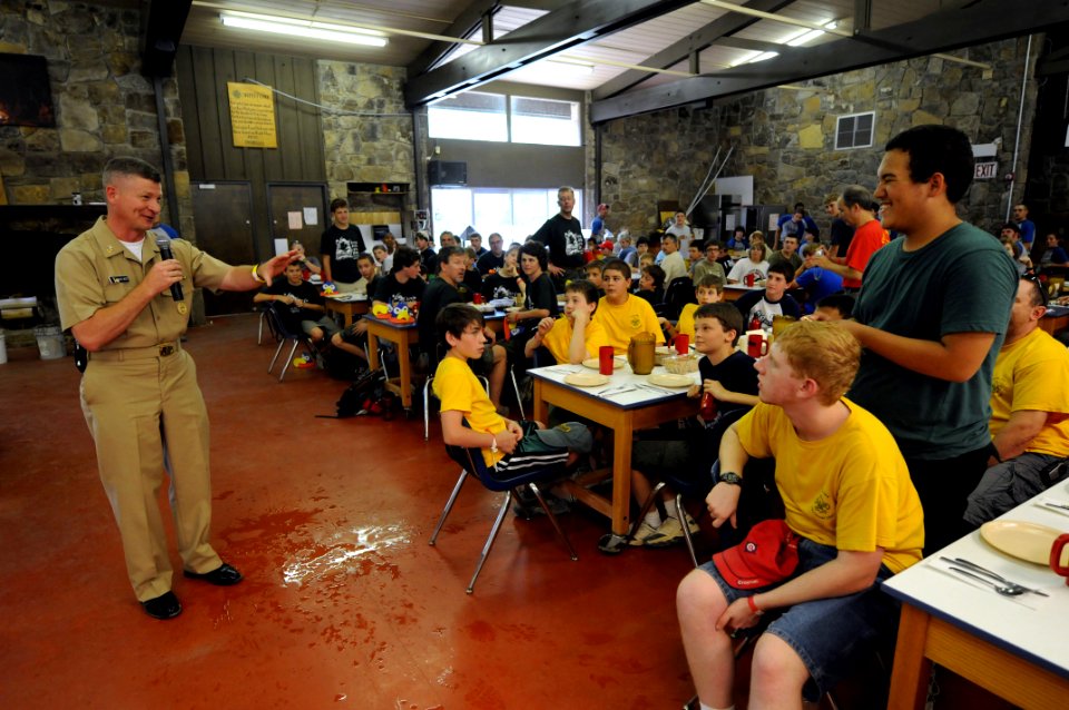 US Navy 090609-N-9818V-258 Master Chief Petty Officer of the Navy (MCPON) Rick West presents a MCPON challenge coin to the youngest Eagle Scout at the Skymont Boy Scout Camp