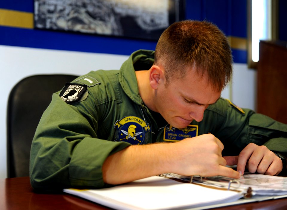 US Navy 090610-N-0413R-008 Lt. j.g. Brian Crosby goes through the weight and balance checks before take-off at Naval Air Station Jacksonville, Fla