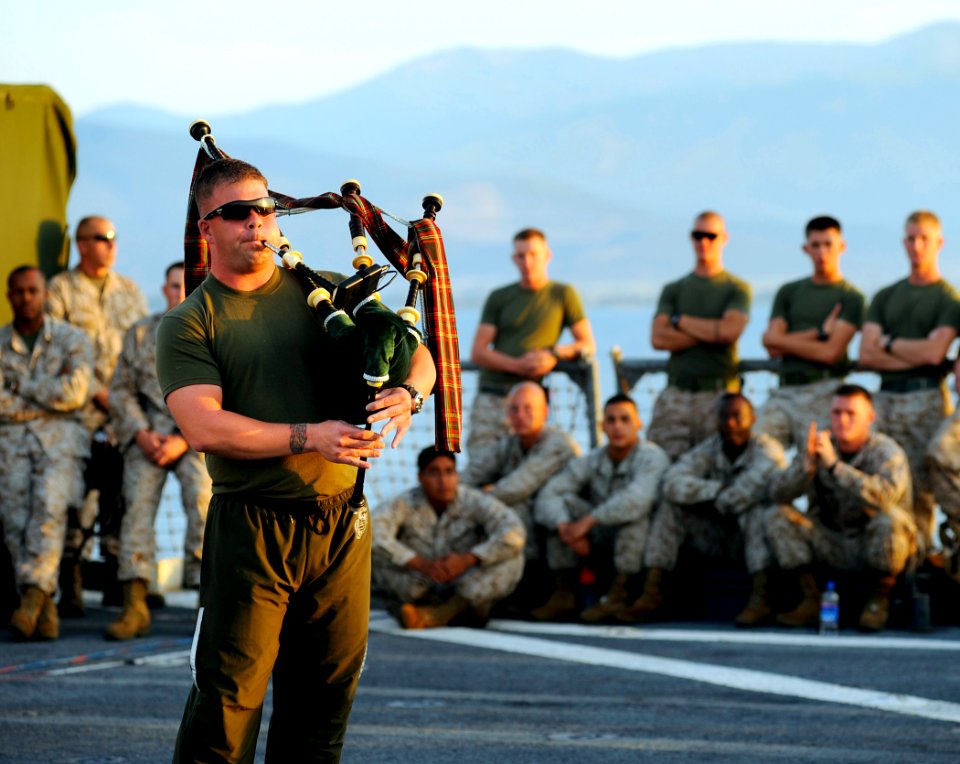 US Navy 090606-N-5345W-377 Cpl. Brian McDonald, assigned to the 22nd Marine Expeditionary Unit (22 MEU) performs a bagpipe medley for the crowd during a morale, welfare and recreation (MWR) sponsored talent show