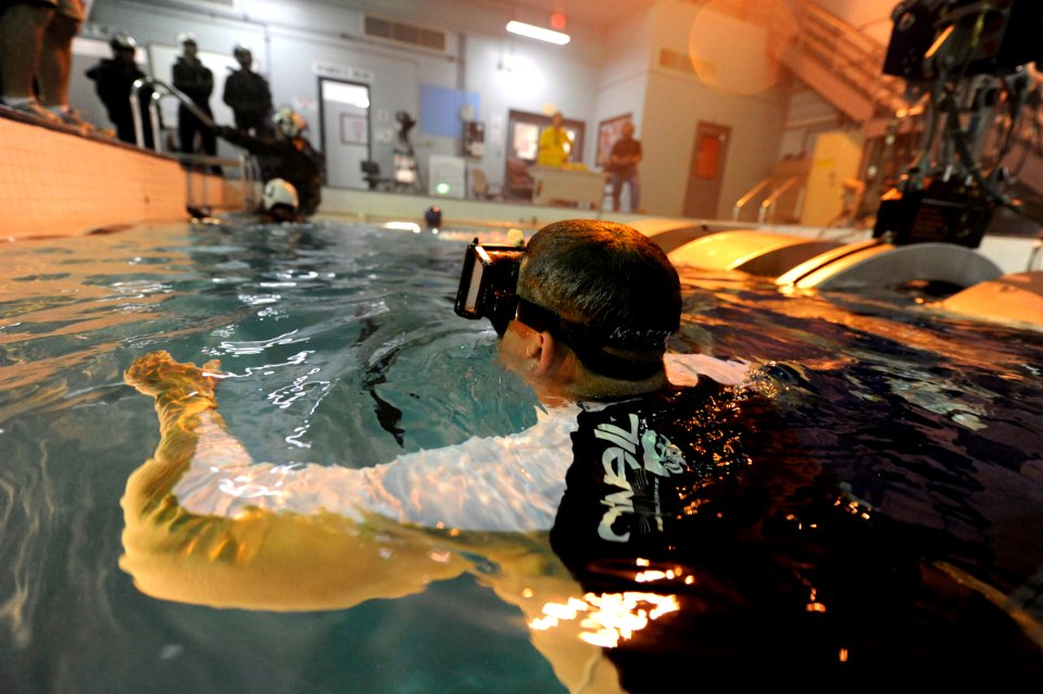 US Navy 090604-N-0413R-050 enior Chief Air Crewman Mark Schuelke ensures that all students safely exit the 9D6B Modular Egress Training System (METS)